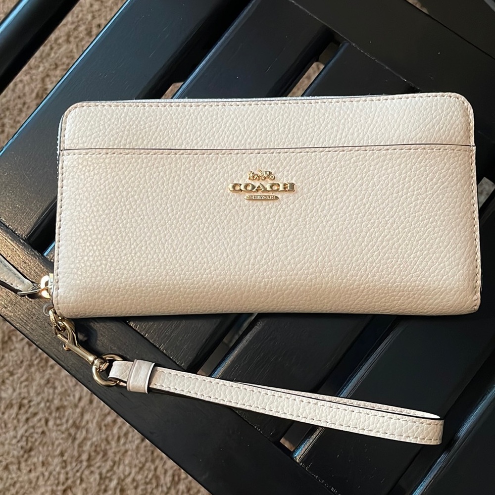 White genuine leather Coach wristlet